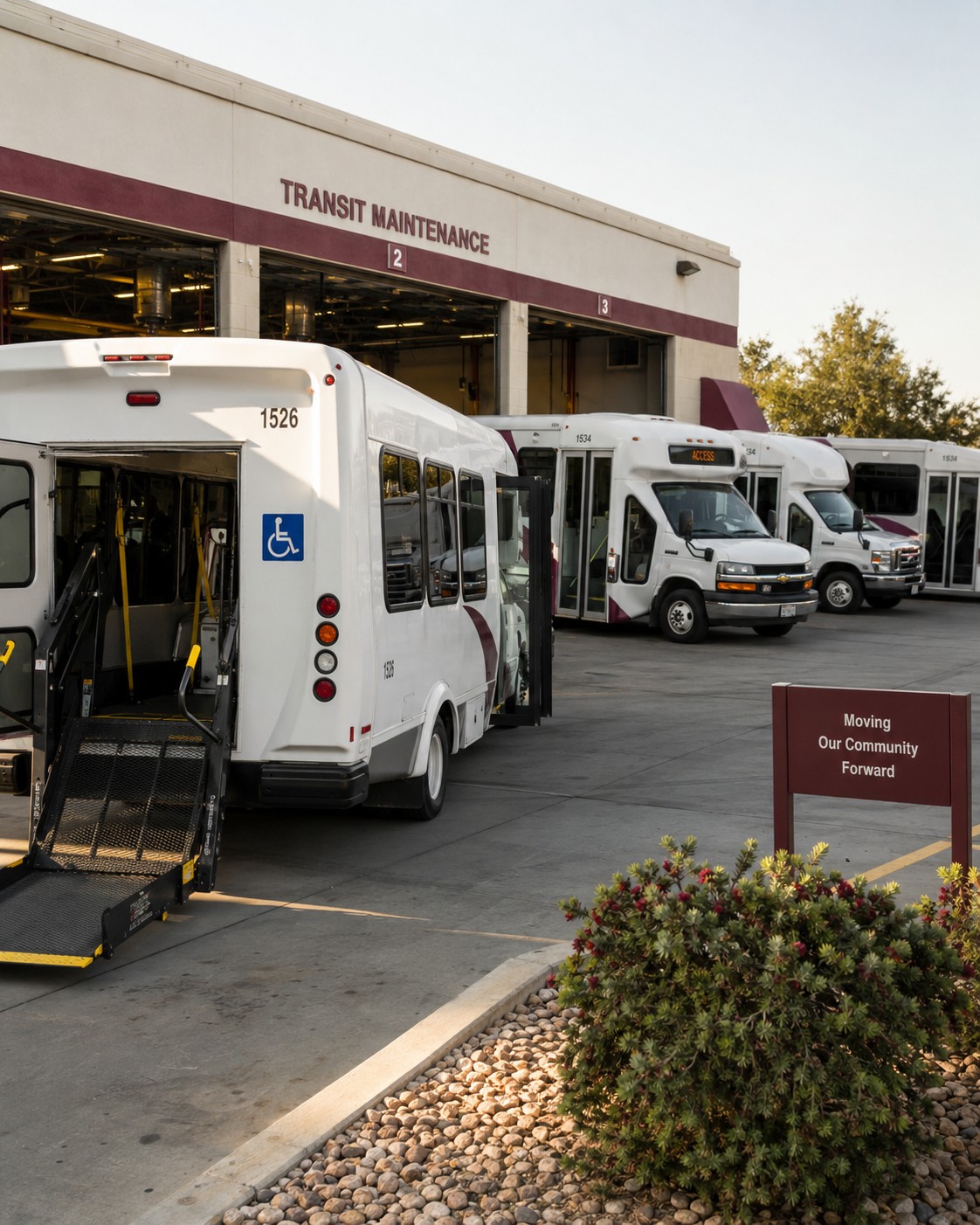 A fleet of accessible vehicles at a transit maintenance facility